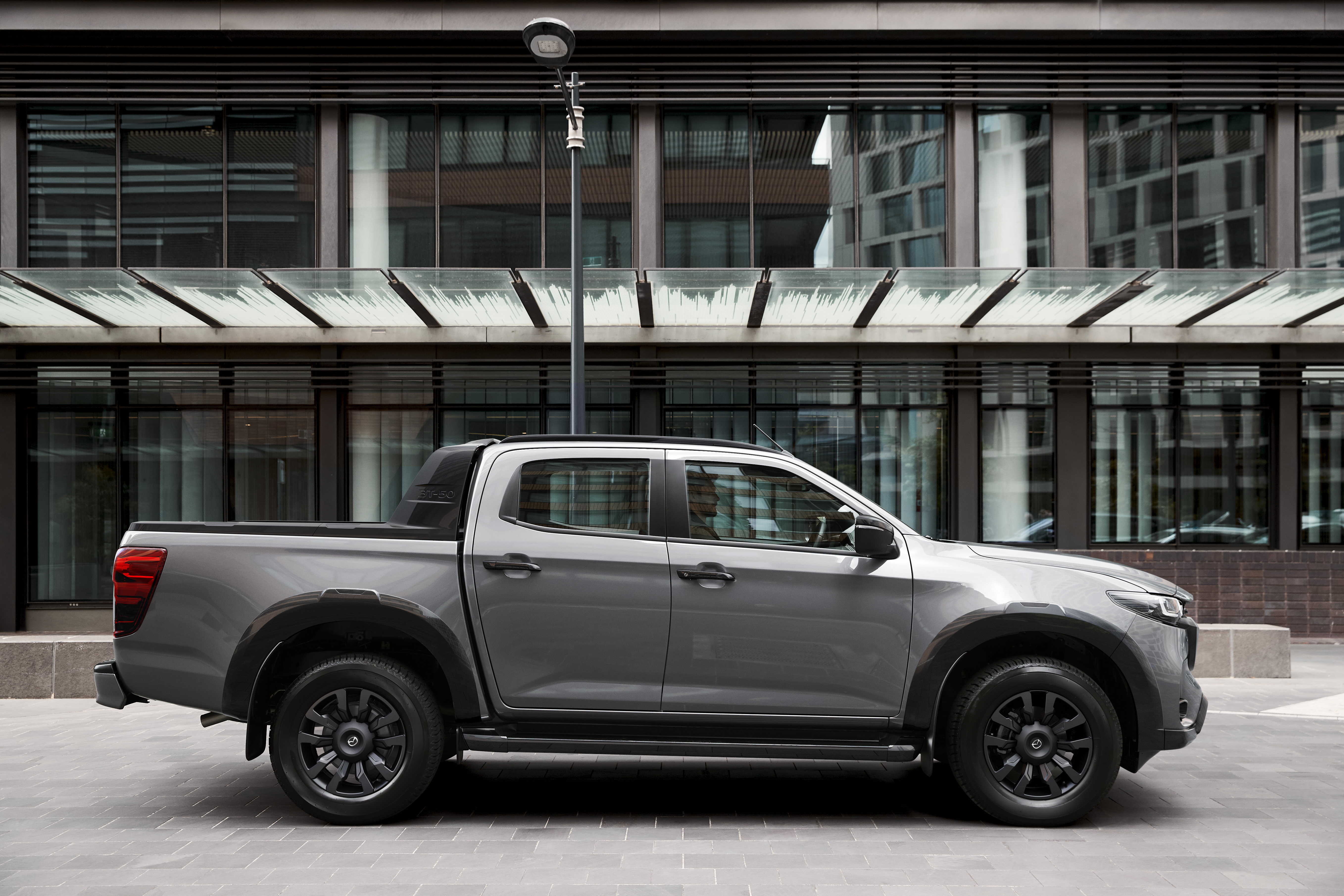 2024 BT 50 AUS RHD C004 SP Pkg EXT Side Profile Concretegray INT Blackterracotta Until20271215